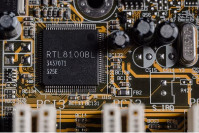 A circuit board with numerous electronic components soldered onto it.