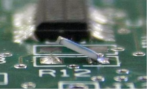 The tombstone effect of components on a PCB.