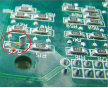 The tombstone effect of components on PCB pads.